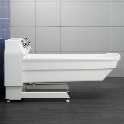 A white lift care tub that can be lowered for a lifter